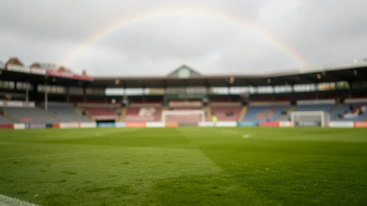 Generic image of a football pitch with a rainbow in the sky.